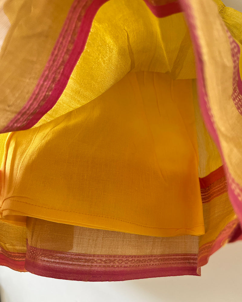 Basant yellow infant tiered festive dress in handwoven cotton silk