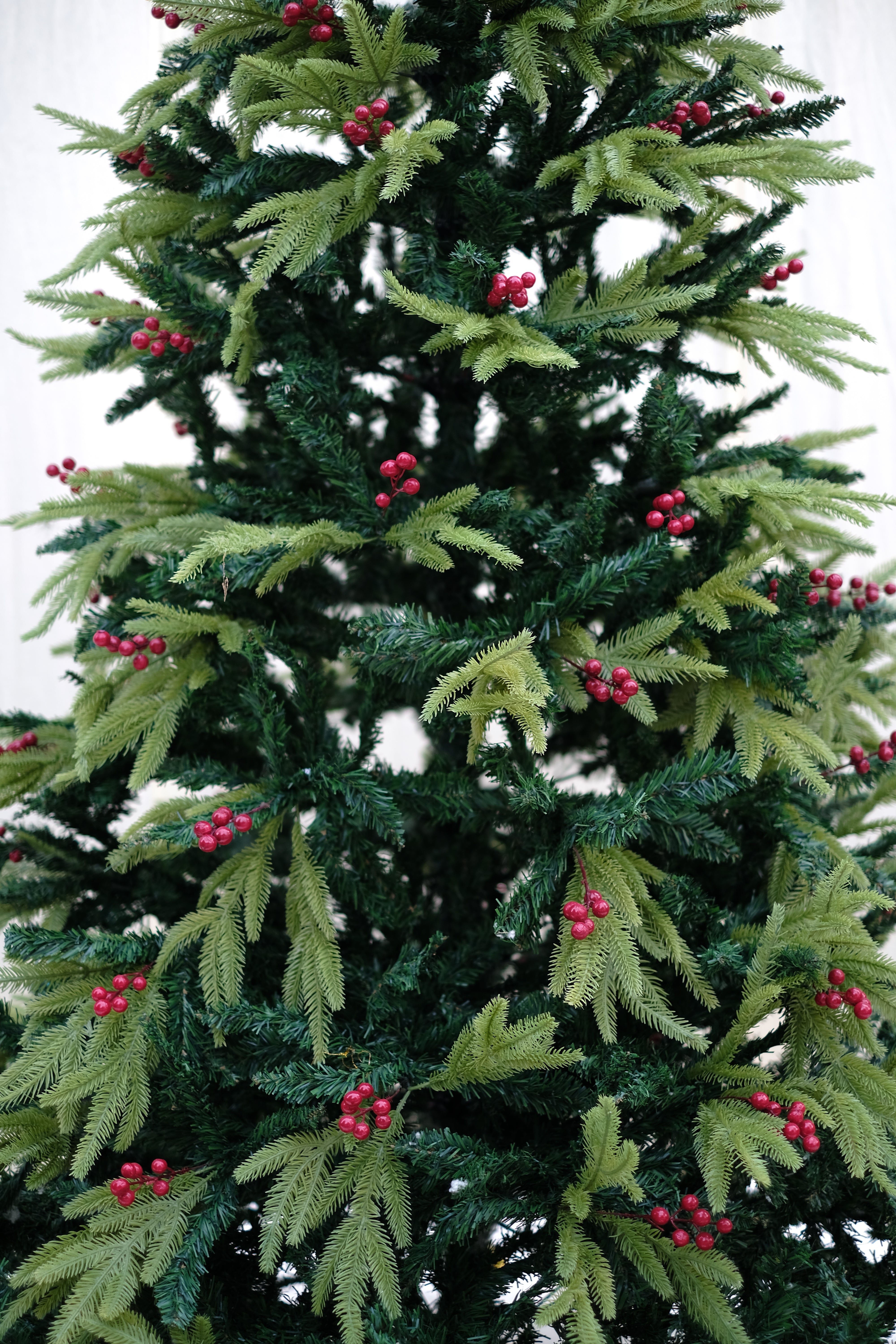 RAZ Christmas tree with cherries and dual color leaves – 8 feet