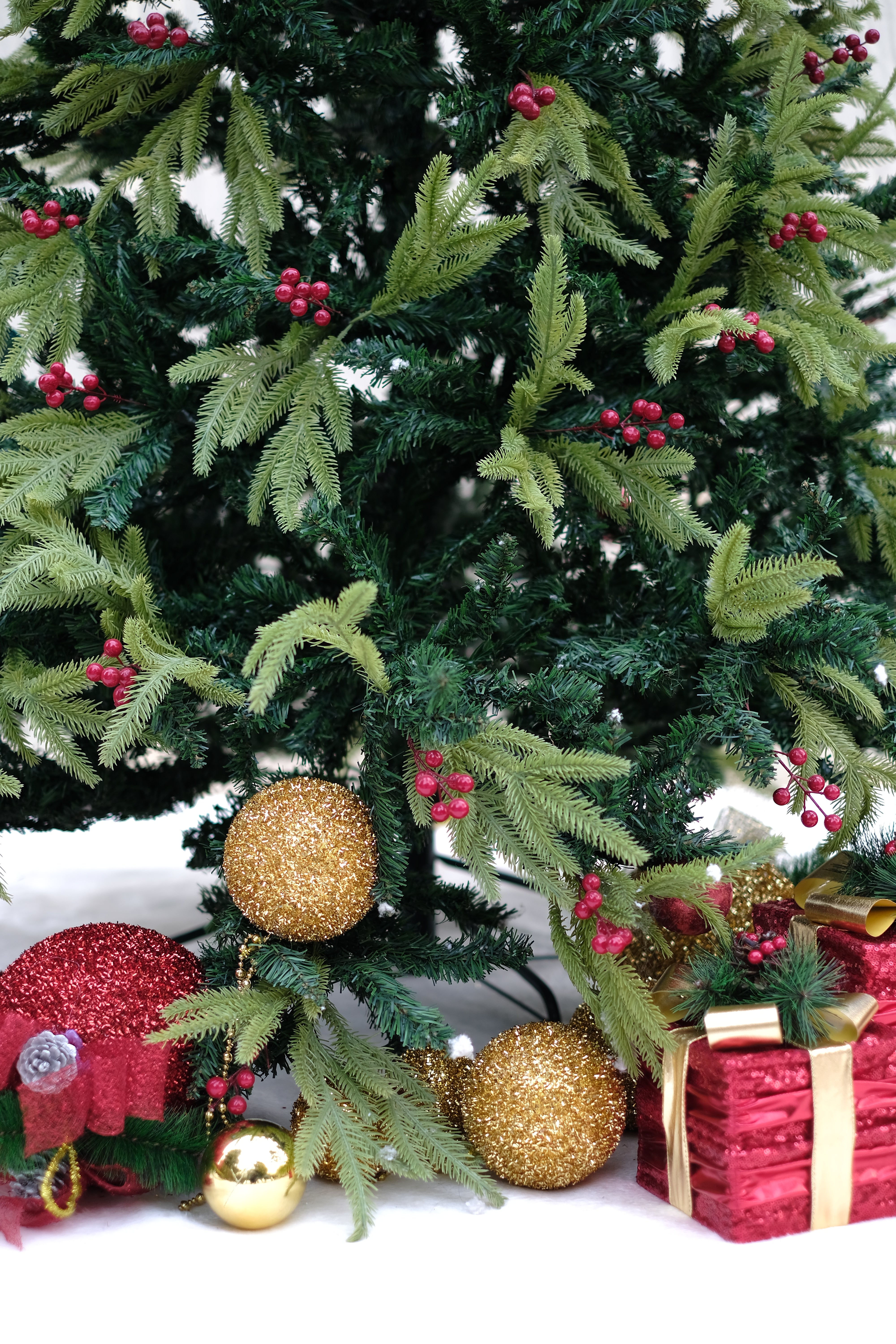 RAZ Christmas tree with cherries and dual color leaves – 8 feet