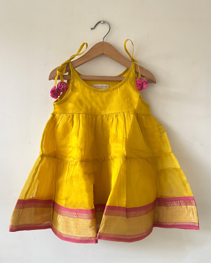 Basant yellow infant tiered festive dress in handwoven cotton silk