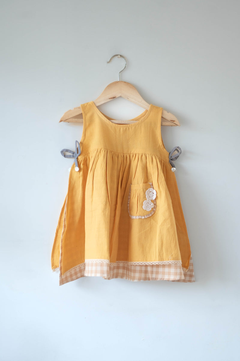 Old photographs sleeveless layered pinafore dress in yellow handwoven cotton