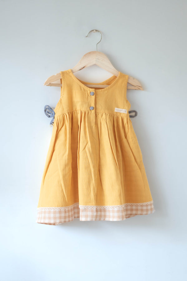 Old photographs sleeveless layered pinafore dress in yellow handwoven cotton