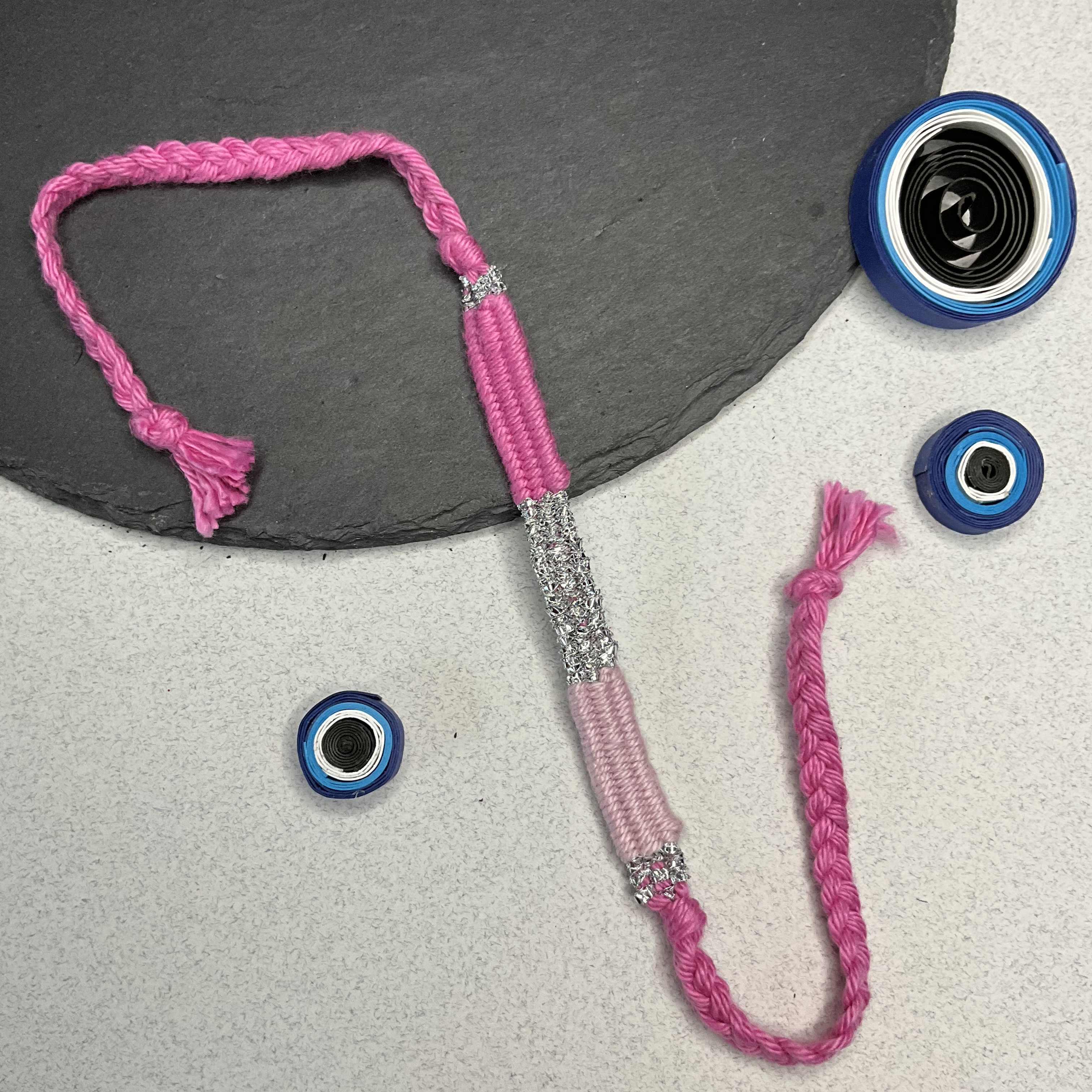 Hues Of Pink Weaved Threads Rakhi
