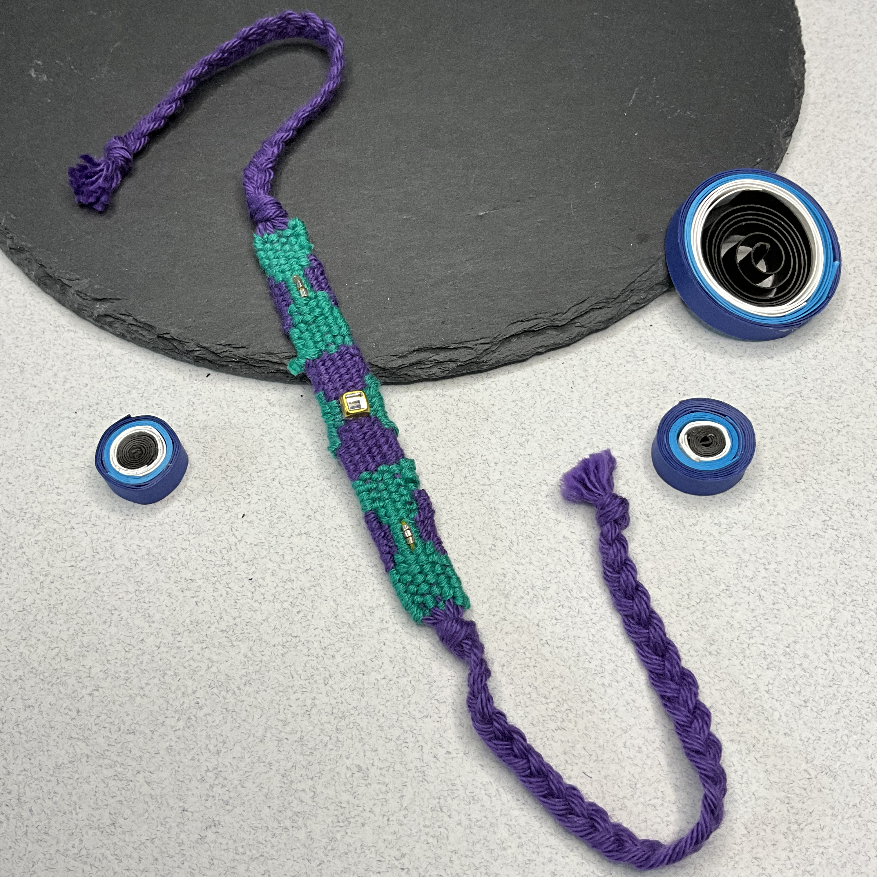 Ikkat Green & Purple Kundan Weaved Threads Rakhi