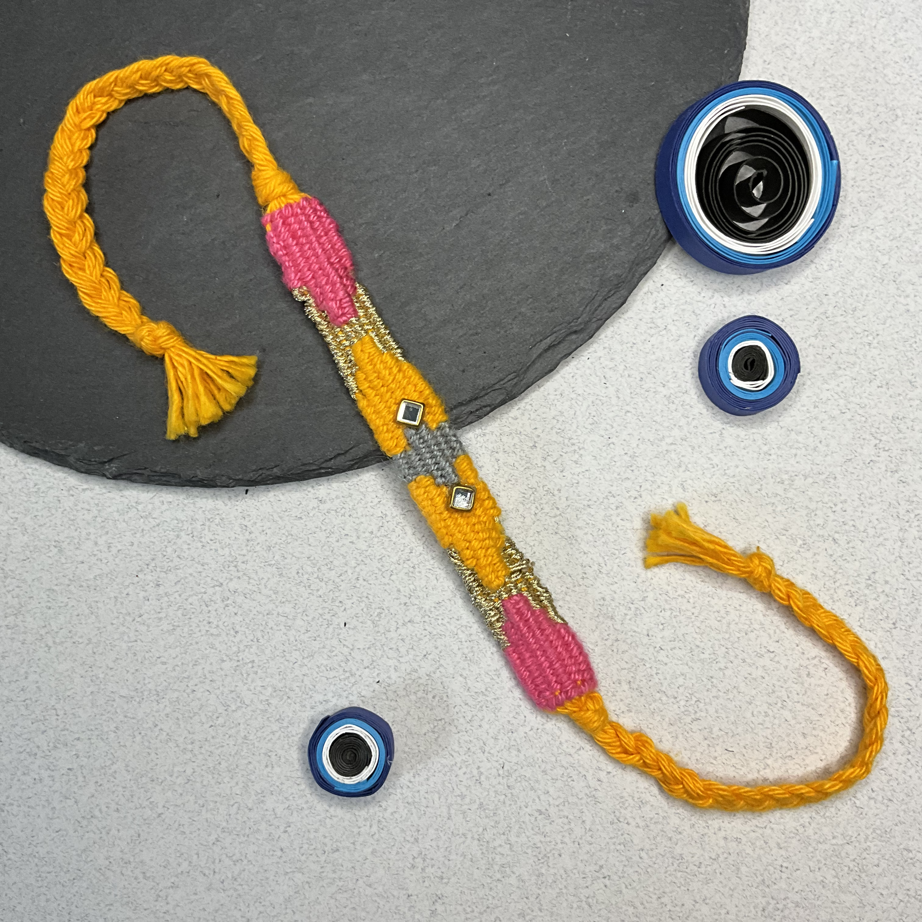Ikkat Orange - Pink - Grey Weaved Threads Rakhi